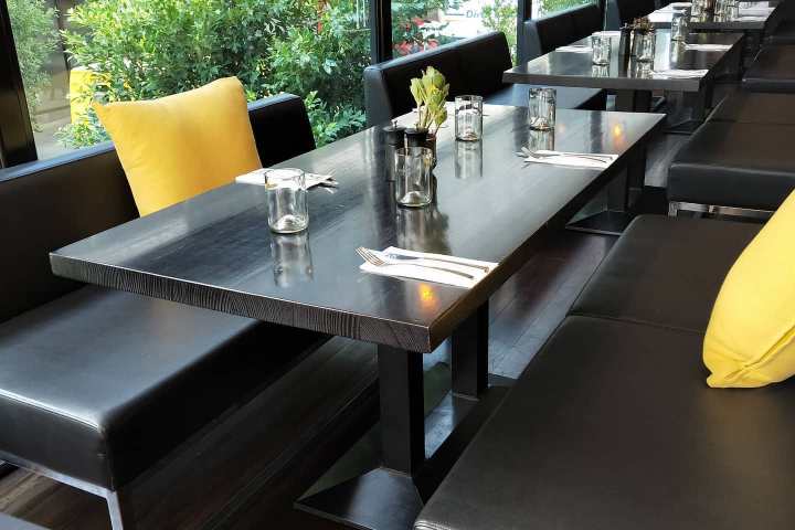 a dining room table in front of a window