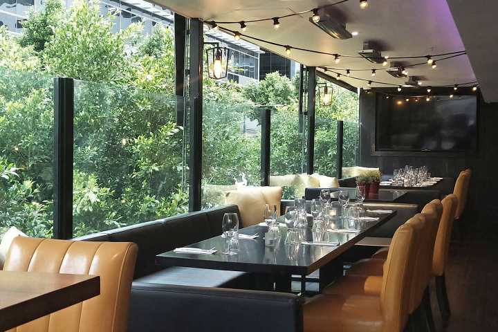 a room filled with furniture and a large window