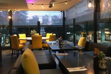 a room filled with furniture and a table in a restaurant