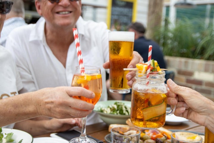 a person sitting at a table with a plate of food