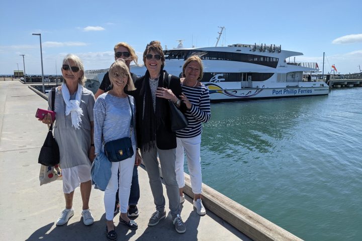 a group of people standing on a dock