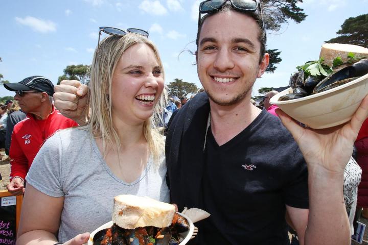 a couple of people that are eating some food