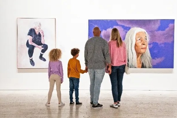 a group of people standing in a room