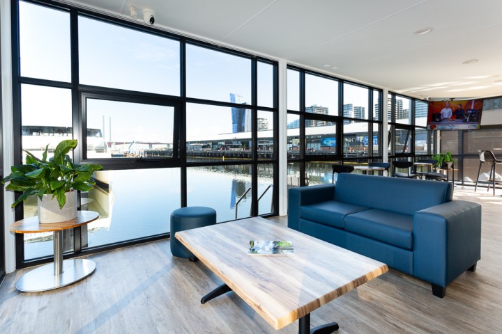 a living room filled with furniture and a large window