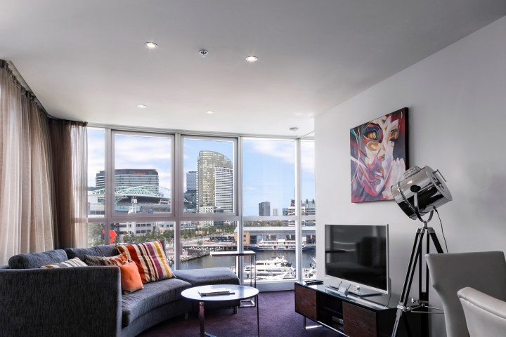 a living room filled with furniture and a flat screen tv