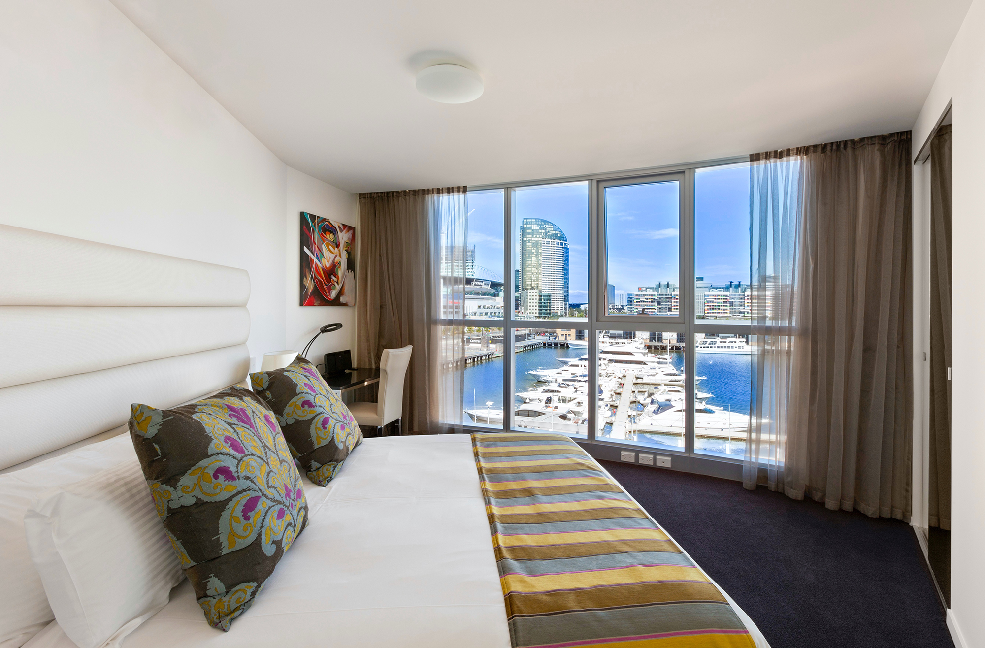 a view of a living room filled with furniture and a large window