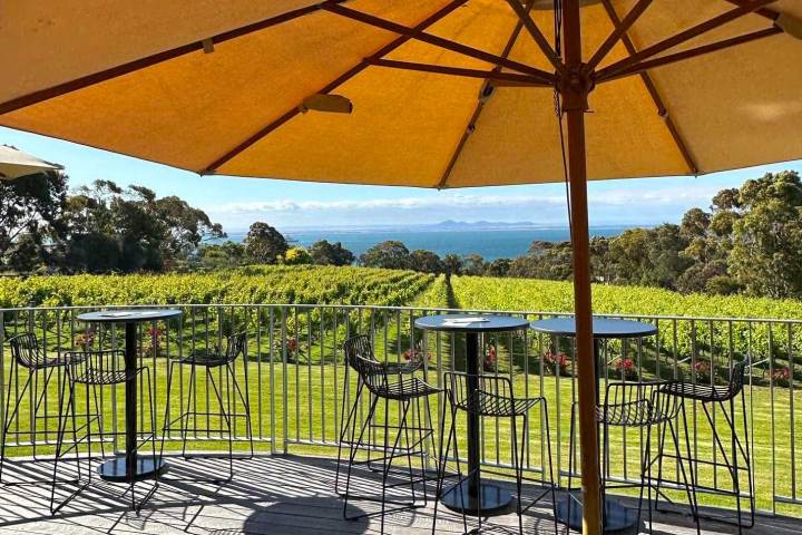 a table topped with a blue umbrella