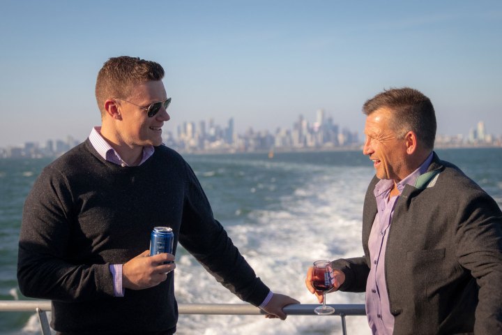 a man standing in front of water