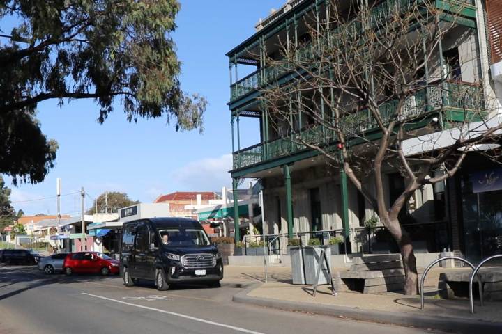 a car driving on a city street