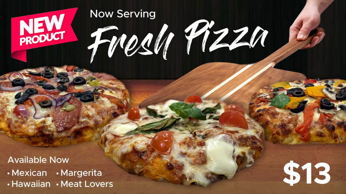 a person holding a slice of pizza