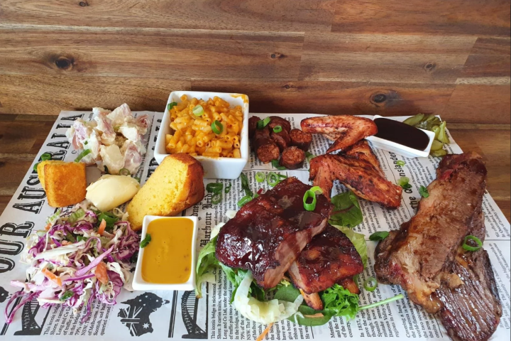 a bunch of food sitting on top of a wooden table