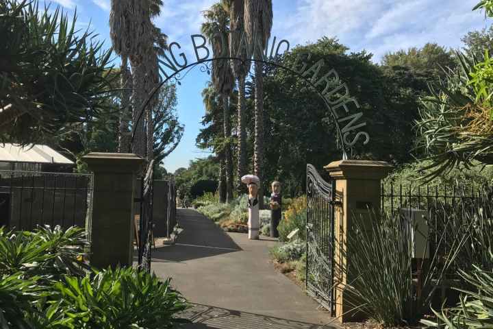 a statue of a person in a garden