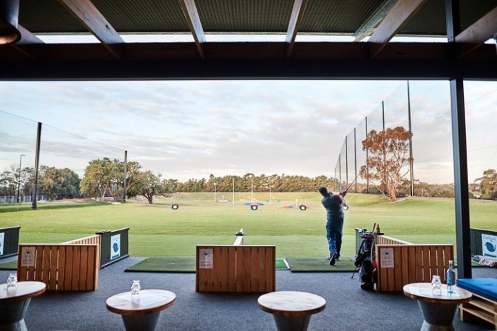 a group of people sitting at a table in front of a window