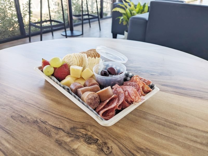 Wine-and-Cheese-Packs-V2 a plate of food on a table