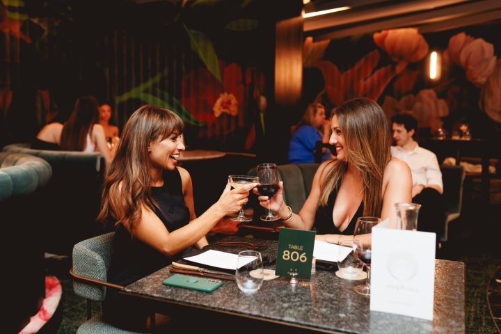 a person sitting at a table in a restaurant