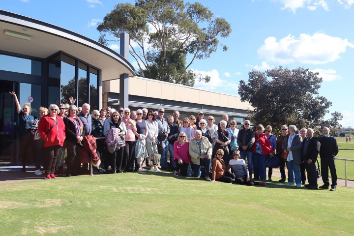 a group of people standing in front of a crowd